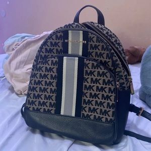 black and brown michael kors backpack purse